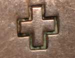 Hallmark cross hallmark symbol of artist Jan Loco, Apache Jeweler – a four-point morning star symbol so often used by her.