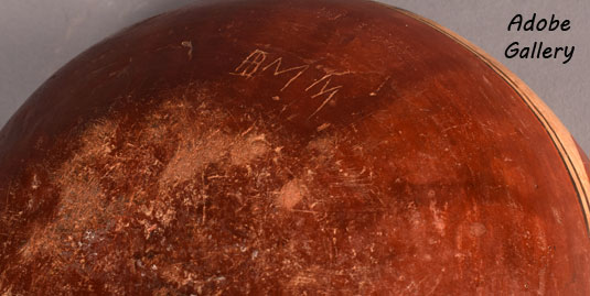 The initials BMM are scratched into the bottom of the bowl.