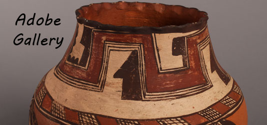 Alternate view of the rim of this pottery jar.