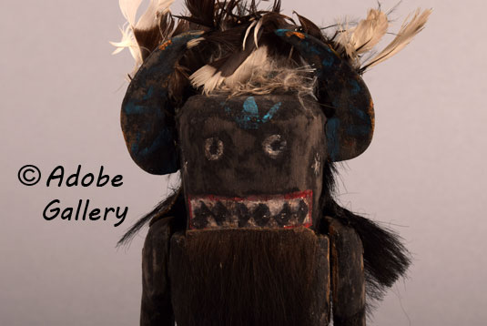 Close up view of the face of this Zuni carving.