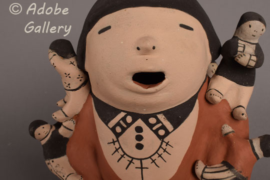Alternate close-up view of the face of this storyteller figurine