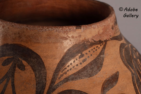 Alternate view of this Zia Pueblo water jar showing rim wear from use.
