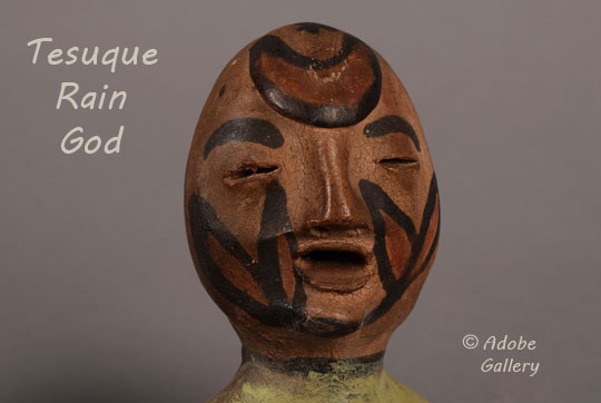 Close up view of the rain god figurine face.