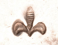 The fleur-de-lis hallmark on the earrings is a mark of Zuni Pueblo artisan Frank Vacit (1915-1999)