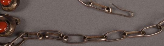 A simple hook and loop design secures this necklace.