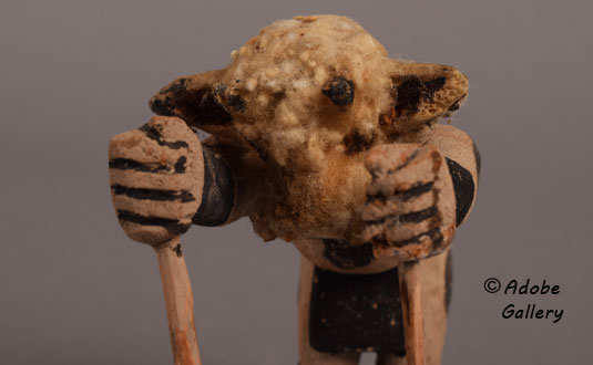 Close up view of the face of this katsina doll.