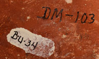 Numbers seen on the bottom of this canteen are unidentified but may be inventory numbers from prior entities that owned the vessel.