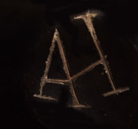 Artist initials signature of Art Cody Haungooah, Santa Clara Pueblo Potter
