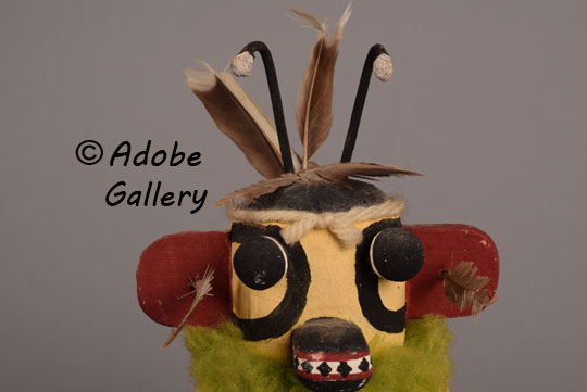 Alternate close-up view of the face of this bee katsina doll.