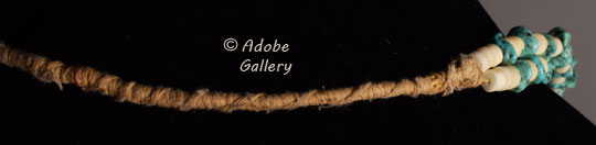 Pueblo Wrap: string wrapped around and coiled tightly - usually used in necklaces to secure them.