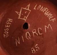 Artist signature of Joseph Lonewolf, Santa Clara Pueblo Potter