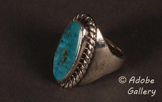 Alternate side view of this silver and turquoise ring.