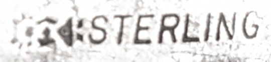 The silver is stamped STERLING and hallmark but there is no maker’s name.  We could not identify the hallmark.