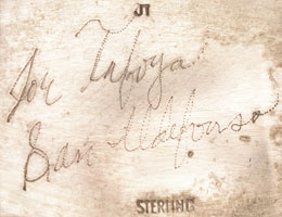 San Ildefonso Pueblo artist Joe Tafoya is a silversmith. It has been seen that he inscribes "Joe Tafoya San Ildefonso" in cursive and "Sterling" in stamped form.