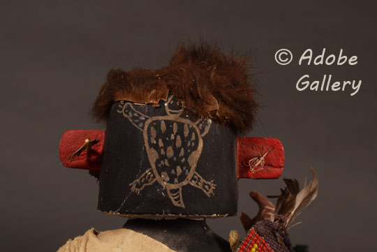 Close up view of the back of the head of this Katsina Doll.