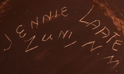 Artist signature of Jennie Laate, Zuni Pueblo Potter