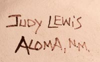 Artist signature of Judy Lewis, Acoma Pueblo Potter