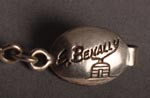 Artist signature and hallmark of Ernest Benally (1959-), Diné Jeweler