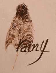 Artist signature of Rainell Naha (1949- ) Feather Woman, She signs on the bottom if her pottery “Rainy” with a beautiful feather next to it. This is the same feather hallmark used by her mother, Helen. 