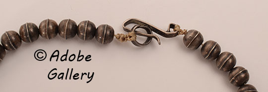 A simple hook and loop design secures this necklace. A simple hook and loop design secures this necklace.