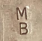 Artist initials - signature of Madeline Beyuka, Zuni Jeweler