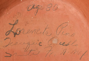 Artist signature of Lorencita Pino, Tesuque Pueblo Potter