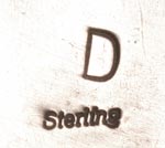 The bracelet is marked on the back “D, Sterling” although we cannot verify who “D” is, considering there are at least a dozen Native jewelers who have signed with this letter. 