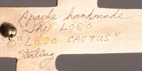 Apache artist signature of Jan Loco, Apache Jeweler.  On the back, she inscribed Apache handmade, Jan Loco, “Loco Cactus” Sterling.