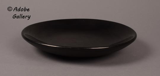 Alterante side view of this blackware plate.