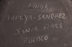 Artist signature of Linda Tafoya-Sanchez (1962 - ) Santa Clara Pueblo