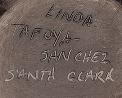 Artist signature of Linda Tafoya-Sanchez (1962 - ) Santa Clara Pueblo, Kha'p'oo Owinge