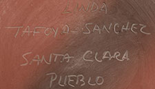 Artist signature of Linda Tafoya Sanchez (1962 - ) Santa Clara Pueblo, Kha'p'oo Owinge