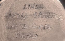 Artist signature of Linda Tafoya-Sanchez (1962 - ) Santa Clara Pueblo, Kha'p'oo Owinge