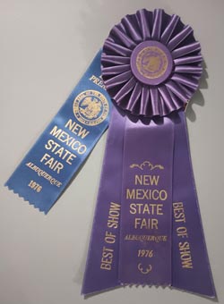 It was probably made specifically for entrance in the New Mexico State Fair in 1976.  That was fortunate because it was awarded “Best of Show” at the Fair that year. The award ribbon accompanies the jar.