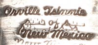 Artist signature of Orville Tsinnie, Diné of the Navajo Nation Silversmith