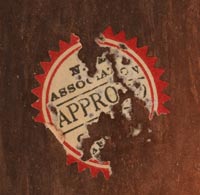 There is a circular label on the back of the tile that reads “APPROVED - N.M. Association of Indian Affairs.”  In 1935 this label was placed on those pieces the judges believed were representative of good Indian art at the Saturday summer fairs under the portal of the Palace of the Governors. 