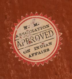 There is a circular label on the back of the tile that reads "APPROVED - N.M. Association of Indian Affairs." In 1935 this label was placed on those pieces the judges believed were representative of good Indian art at the Saturday summer fairs under the portal of the Palace of the Governors.