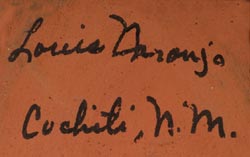 Artist signature of Louis Naranjo, Cochiti Pueblo Potter