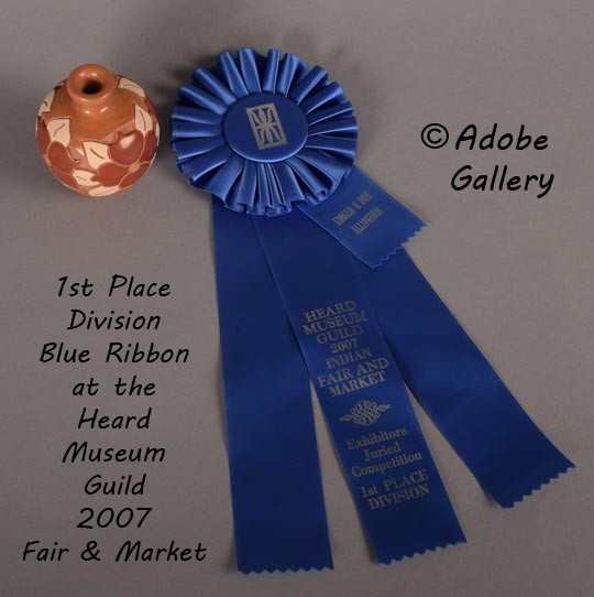 This jar was awarded 1st Place Division Blue Ribbon at the Heard Museum Guild 2007 Fair and Market. The award ribbon accompanies the sale of the jar.