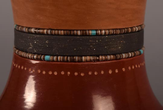 Alternate close-up view of the neck of this pottery vessell.