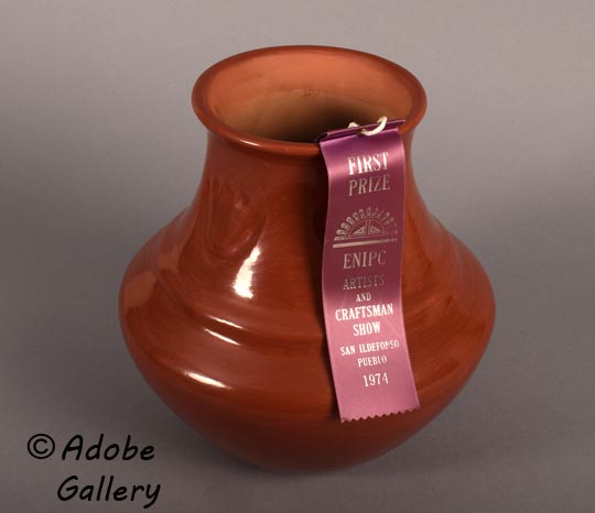 This jar was completed in 1974 and entered in the Eight Northern Indian Arts & Crafts Fair where it was awarded First Prize. The blue ribbon is available with the jar.