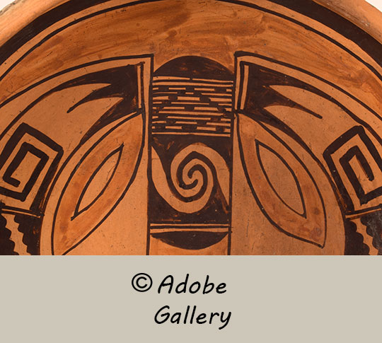 Close up view of a section of this pottery vessel.