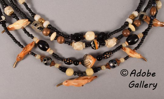 Close-up view of the hummingbirds on this necklace.