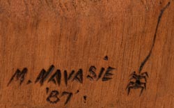 Artist signature and hallmark of Muriel Navasie (1954-1988) Hopi-Tewa.  She signs her works with “M. Navasie ‘87” accompanied by her trademark spider on a strand.