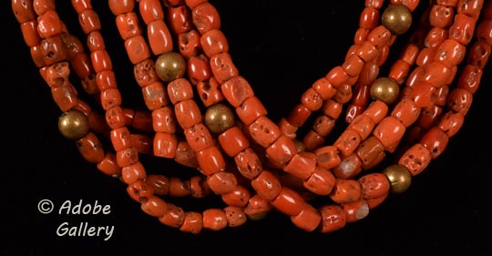 Close up view of a section of this coral necklace.