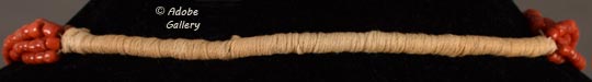 Pueblo Wrap: string wrapped around and coiled tightly - usually used in necklaces to secure them.