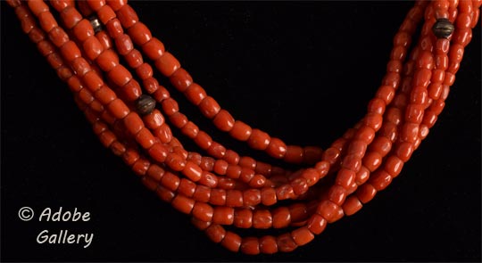 Close up view of the interplay of coral and metal beads.