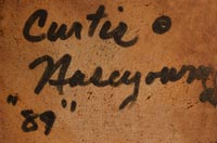 Artist signature of Curtis Naseyowma, Hopi Pueblo Carver