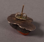 The earrings are fitted with silver posts for pierced ears.