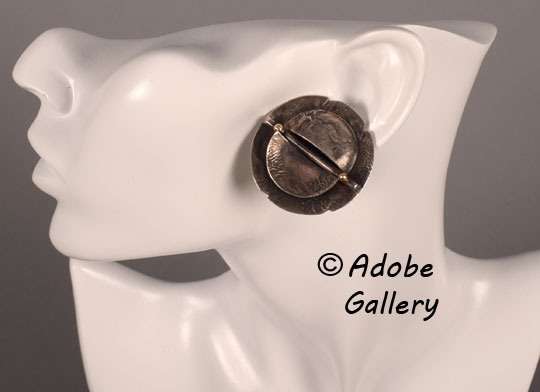 Alternate view of one of the earrings being worn. Alternate view of one of the earrings being worn.